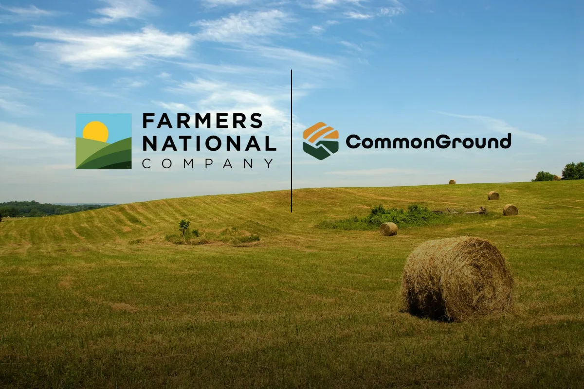 Farmers National Company and CommonGround logos over a hay field